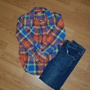 Boys flannel shirt and skinny jeans.